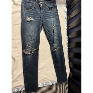 A&E dark washed distressed jegging size 4